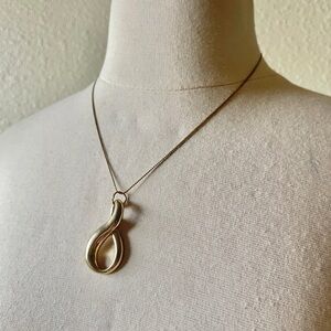 Vintage large infinity pendant on dainty gold chain treble clef style